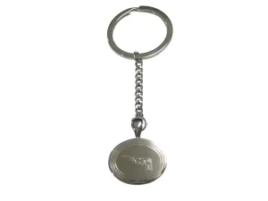 Silver Toned Etched Oval Stealth Bomber Plane Pendant Keychain